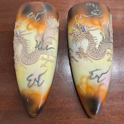 Sale Photo Thumbnail #101: Pair of vintage Japanese Dragonware Moriage ceramic wall pocket vases with raised dragon motifs and smoked orange glaze.
