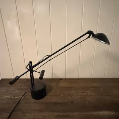 Sale Photo Thumbnail #124: Black metal counterbalanced boom desk lamp with an adjustable arm and dome shade, late 20th century.