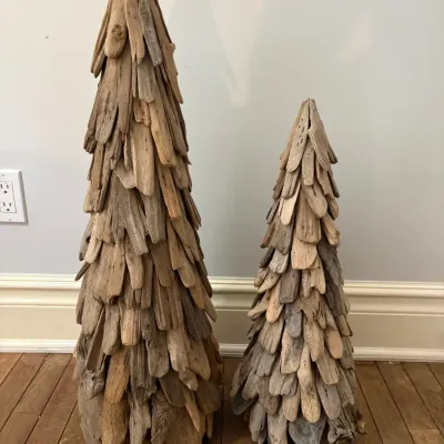 Sale Photo Thumbnail #161: Pair of rustic driftwood cone Christmas tree sculptures in varying sizes.