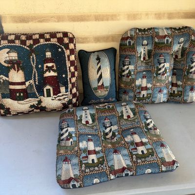 Sale Photo Thumbnail #134: Set of 4 woven tapestry cushions and accent pillows featuring lighthouse motifs. Includes two matching chair seat pads with rope border lighthouse patterns, one small North Carolina Cape Hatteras lighthouse accent pillow, and one square decorative pillow 