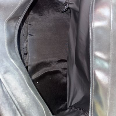 Sale Photo Thumbnail #2: A black Calvin Klein tote bag/duffel, features double handles, silver-tone hardware, full zip closure, and spacious interior lined compartment. Ideal for travel, weekender, or daily use. Overall good pre-owned condition with light signs of wear.
20X10in