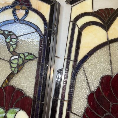 Sale Photo Thumbnail #329: A 3-panel hinged stained glass fireplace screen featuring an intricate Art Nouveau floral/fan pattern in shades of deep red, green, cream, and textured clear glass. Heavy leaded metal framework with hinges connecting the side panels to the central arched 