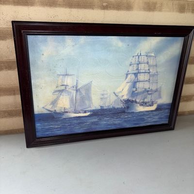 Sale Photo Thumbnail #107: 25.5X18in
Framed maritime print depicting tall sailing ships on the open sea. Housed in a dark wooden frame. Shows some minor surface wear and light discoloration on the print consistent with age, but overall in good displayable condition.
