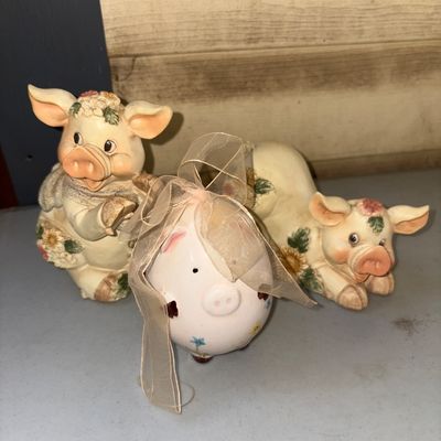 Sale Photo Thumbnail #351: A charming group of three pig-themed decorative items including two detailed floral resin/ceramic pig figurines and a small floral painted ceramic pig with a sheer ribbon bow. Items show light surface wear consistent with age and display, but appear in ov
