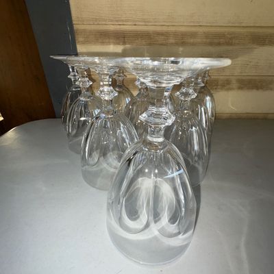 Sale Photo Thumbnail #289: A set of clear crystal or glassware goblets/ glasses, shown displayed upside down. Features ribbed/paneled bowls and faceted, detailed stems. Appears to be in good pre-owned condition with no visible chips or cracks seen in the photo.
6in tall