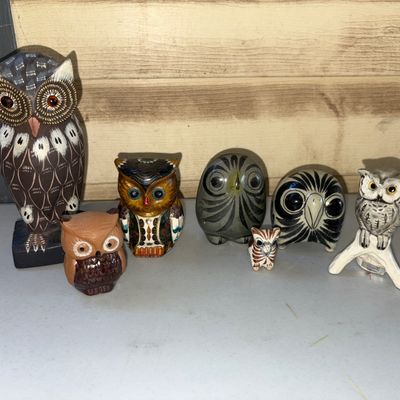 Sale Photo Thumbnail #20: Collection of seven owl figurines in various styles and sizes. Includes carved wood, glazed pottery, tonala-style clay, and detailed ceramic owls. Items appear to be in good pre-owned condition with minor surface wear typical of age.
Tallest 5.5in
Smalles