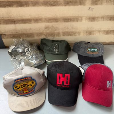 Sale Photo Thumbnail #102: Collection of 6 baseball caps and trucker hats. Items appear to be in good condition, with some showing light wear and others appearing unworn or packaged.