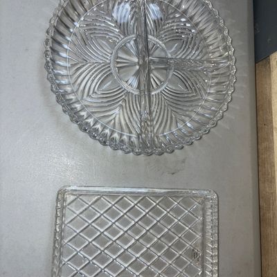 Sale Photo Thumbnail #286: Includes a round, 3-section divided glass serving dish with a scalloped edge and leaf/fan pattern, and a rectangular glass tray with a diamond lattice pattern. Both items appear to be in good condition with no visible cracks or major chips.
Circle dish 7i
