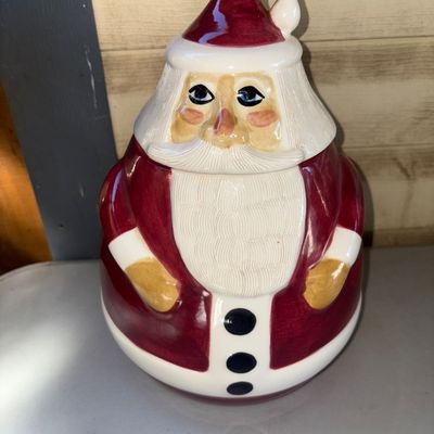 Sale Photo Thumbnail #271: A ceramic Santa Claus cookie jar featuring a glazed finish and removable lid (Santa's head). Appears to be in good pre-owned condition with no visible cracks or major chips.
12.5in tall
