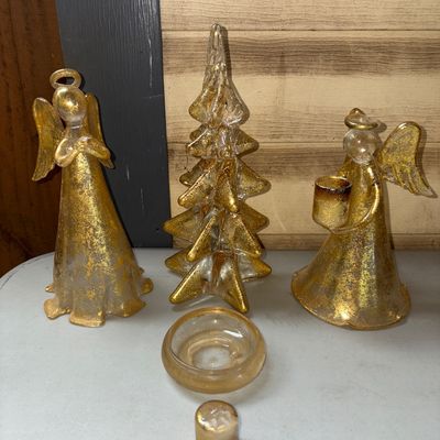 Sale Photo Thumbnail #314: Set of decorative holiday table pieces made of clear glass with gold speckle finish. Includes two standing angel figurines, a stylized Christmas tree figure, a small round dish, and a small decorative insert. May have chips or broken pieces please review 