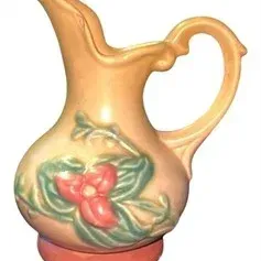 Vintage Roseville Art Pottery Freesia pitchervase in tan and terracotta tones with embossed floral design, circa 1940s.