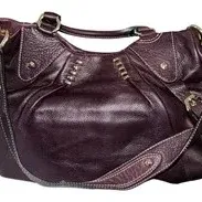 Deep purple pebbled leather handbag with gold-tone hardware, buckle details, and dual handles with a shoulder strap.