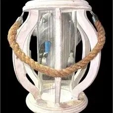 Nautical-style distressed white wooden candle lantern with an inner glass cylinder and a thick rope handle.