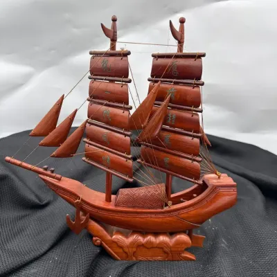 Vintage handcrafted wooden model of a traditional Chinese junk ship with ribbed 
