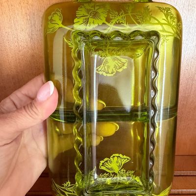 Vintage olive green depression glass divided relish dish with an etched floral poppy pattern and integrated center handle.