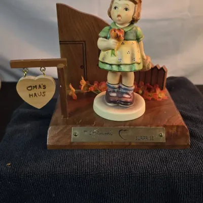 Goebel M.I. Hummel #431 “The Surprise” — 1981 Collectors' Club Exclusive with Decorative Wooden Disp