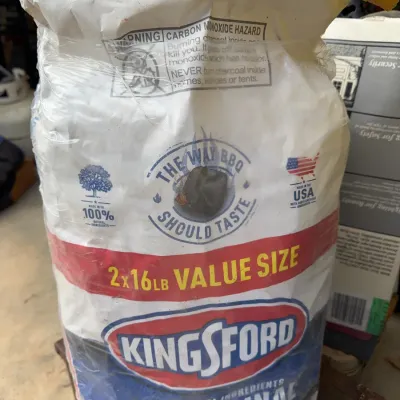 Sale Photo Thumbnail #256: Unopened twin pack of Kingsford The Original charcoal briquettes, featuring two 16 lb bags in plastic wrap.