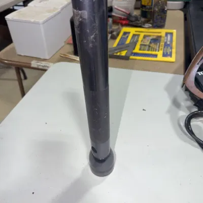 Sale Photo Thumbnail #193: Vintage heavy-duty Maglite-style metal flashlight, showing visible wear and scuffs from use.