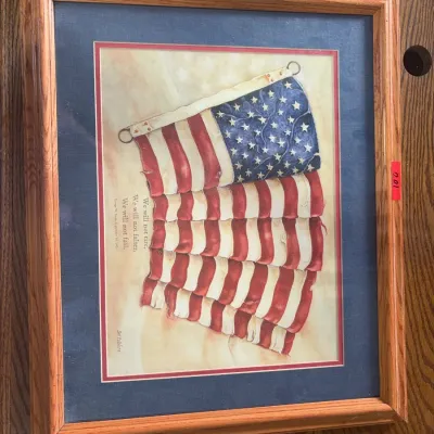 Sale Photo Thumbnail #62: Framed patriotic art print featuring an American flag illustration and quote by George W. Bush, set in a light oak wooden frame with double matting.