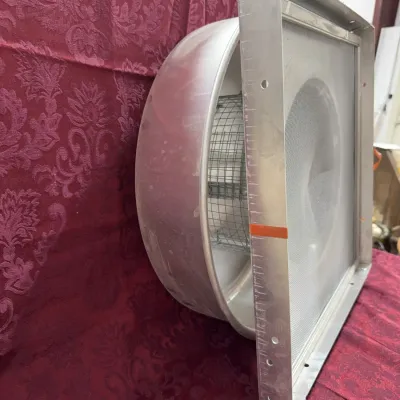 Sale Photo Thumbnail #6: Commercial aluminum roof exhaust fan housing featuring a square mounting base with a mesh screen and a rounded protective dome.