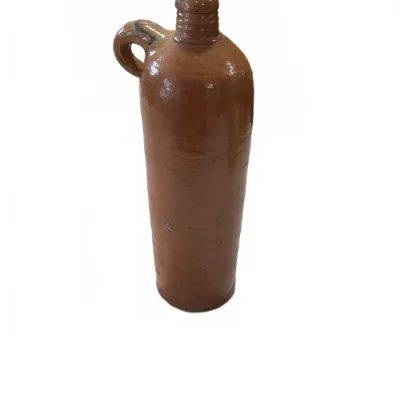 Sale Photo Thumbnail #269: Antique brown glazed stoneware jug with a side handle and cork stopper, showing light surface wear consistent with age.