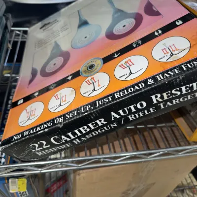 Sale Photo Thumbnail #220: Do-All Outdoors .22 caliber auto-reset rimfire handgun and rifle target in original packaging.