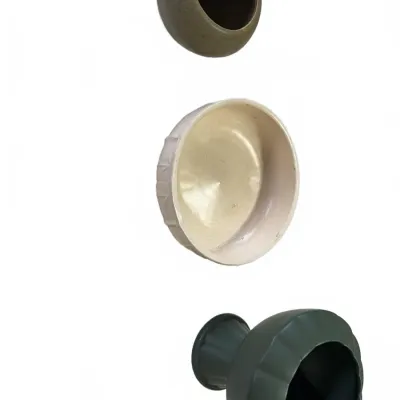 Sale Photo Thumbnail #287: Set of three vintage ceramic planters and vessels in neutral earth tones, featuring varied textures and pedestal details.