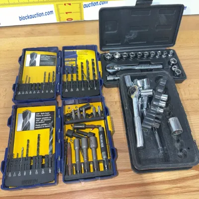 Sale Photo Thumbnail #203: Assortment of hand tools including Irwin drill bit and driver bit sets in plastic cases alongside Craftsman and unbranded socket ratchet sets.