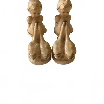 Sale Photo Thumbnail #297: Pair of vintage mid-century ceramic bookends or figurines featuring Dutch girls with geese, finished in a matte tan glaze with subtle brown accents.