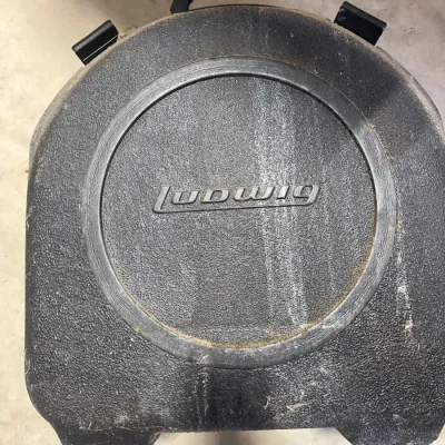Sale Photo Thumbnail #172: Vintage Ludwig hard shell snare drum case featuring a molded black textured finish with raised logo.