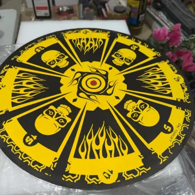 Sale Photo Thumbnail #185: On Target circular dart or game board graphic featuring yellow and black skulls and flame motifs with point values.