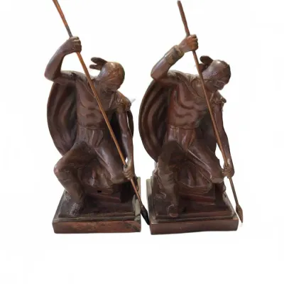 Sale Photo Thumbnail #265: Pair of vintage bronze-finish bookends featuring Native American warriors with spears and shields.