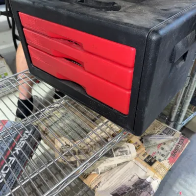 Sale Photo Thumbnail #222: Vintage Excel black molded plastic portable toolbox featuring three red drawers and a top carrying handle.