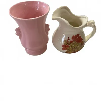 Sale Photo Thumbnail #267: Pair of vintage ceramic items, including a pink urn-style vase with side handles and a cream-colored pitcher featuring a grape harvest decal.