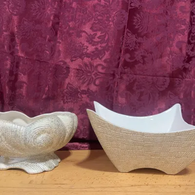 Sale Photo Thumbnail #132: Pair of mid-century ceramic planters, including a seashell-shaped pedestal bowl and a textured basket-weave dish.