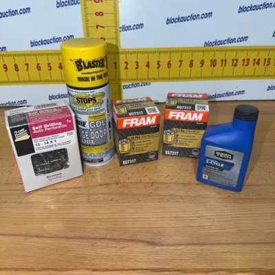 Sale Photo Thumbnail #197: Assorted garage supply lot including a box of self-drilling screws, a can of B'laster garage door lube, two FRAM Ultra Synthetic oil filters (XG7317), and a bottle of Super Tech 2-cycle engine oil.