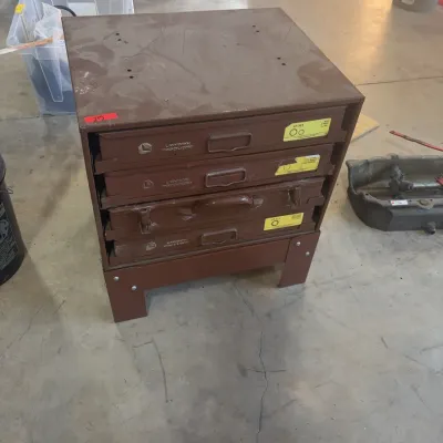 Sale Photo Thumbnail #76: Brown metal Lawson Products industrial storage cabinet with four pull-out drawers, featuring original yellow labels and heavy-duty metal handles.