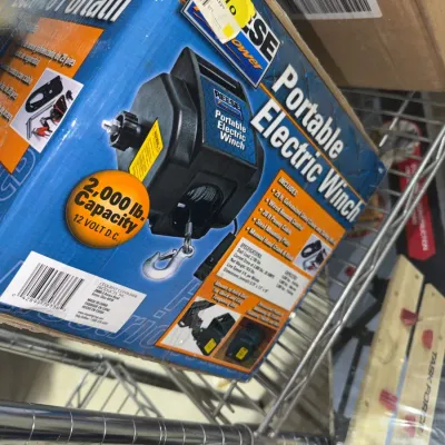 Sale Photo Thumbnail #221: Reese Towpower 12-volt portable electric winch with a 2,000 lb. capacity, packaged in its original box.