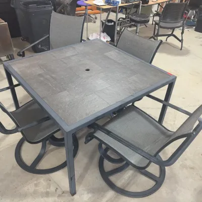 Sale Photo Thumbnail #68: Modern outdoor dining set featuring a square tile-top umbrella table and four matching gray mesh swivel chairs.