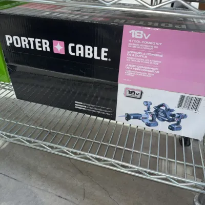 Sale Photo Thumbnail #205: boxed Porter-Cable 18V four-tool cordless combo kit, featuring a drill/driver, reciprocating saw, circular saw, and flashlight.