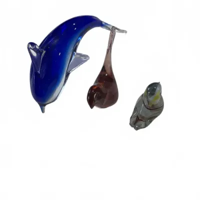 Sale Photo Thumbnail #288: Set of three vintage hand-blown glass animal figurines, including a cobalt blue dolphin, a amber-colored bird, and a small grey bird.