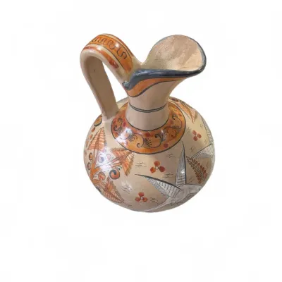 Sale Photo Thumbnail #260: Hand-painted Tonala Mexican pottery pitcher, featuring a pinched spout, loop handle, and intricate bird and floral motifs.
