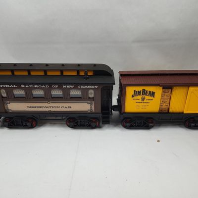 Sale Photo Thumbnail #242: Pair Jim Beam Train Porc. Decanters