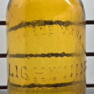 Sale Photo Thumbnail #131: Trademark Lightening Half Gal Amber Fruit Jar