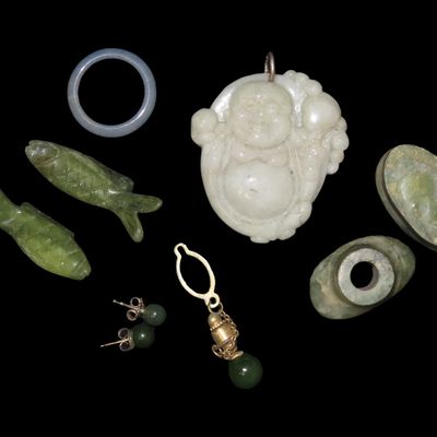 Sale Photo Thumbnail #700: Lot of Chinese Jade Items, Including Pair of Fish, Tie Clasp, Ear Spools, Earring, Buddha Pendant, Ring, etc.