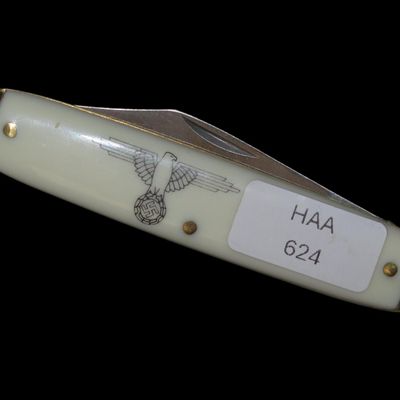 Sale Photo Thumbnail #622: Vintage WWII German Nazi-Themed Pocket Knife with Swastika and Hitler Imagery