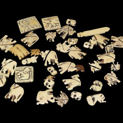 Sale Photo Thumbnail #518: Large Lot of Hand-Carved Bone Elephant Effigy Beads / Pendants / Charms