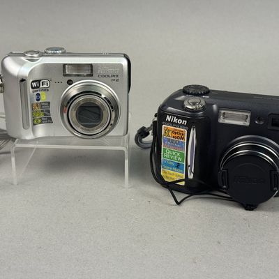 Sale Photo Thumbnail #274: Two Nikon Coolpix Digital Cameras