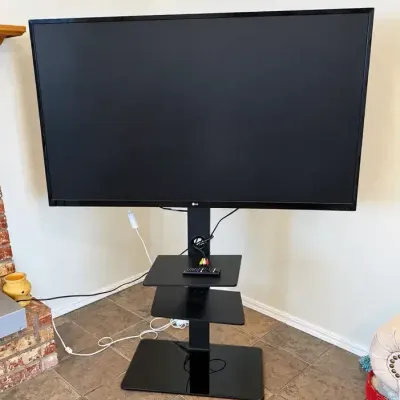  LG 55" Flat Screen TV with Floor Stand / Entertainment Center & Remote