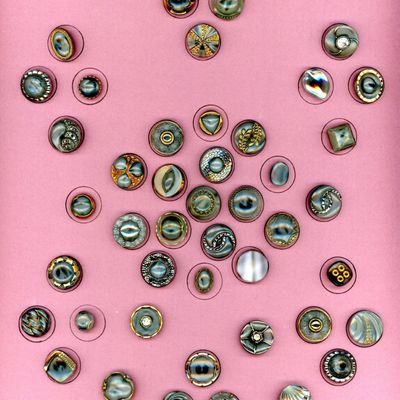 A CARD OF DIVISION THREE MOONGLOW GLASS BUTTONS